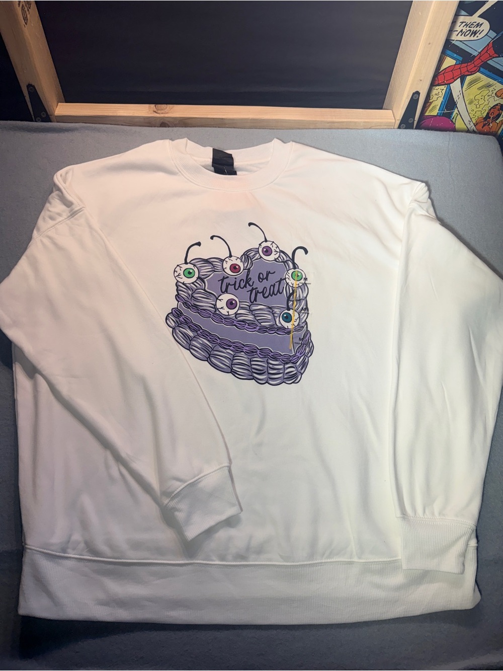 White Crewneck Sweatshirt with Purple Halloween Cake Graphic